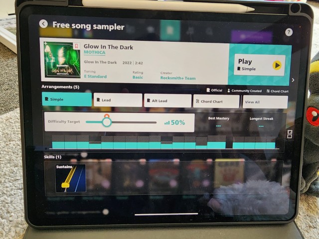 iPad showing Rocksmith+ song detail page for Glow In The Dark by MOTHICA